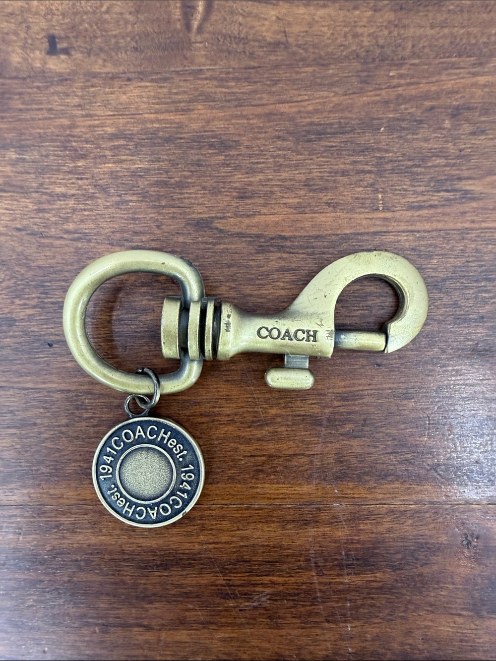 COACH Antique Brass Key Clip with Round Logo Charm - Brass - Picture 2 of 5
